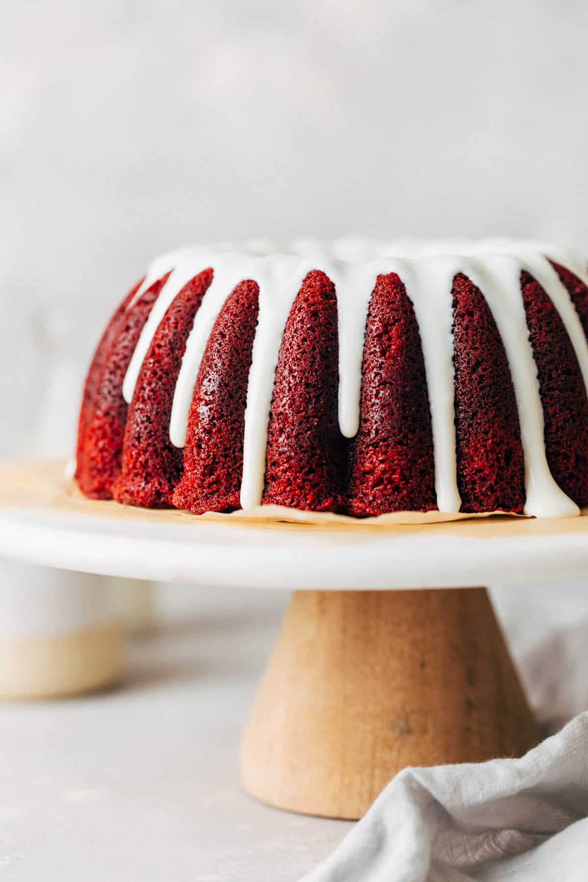 red bundt cake with frosting on top