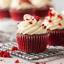 red velvet cupcake with white cream cheese frosting on top